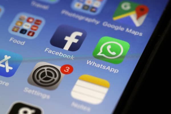WhatsApp app on an older iPhone model