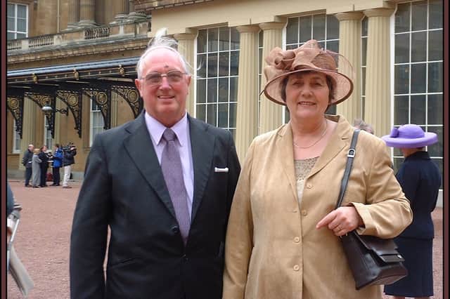 Mavis Robinson with her husband Ernest on the day she received her MBE.