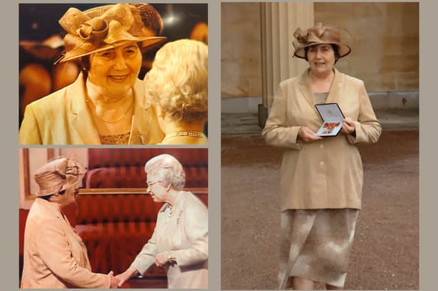 Mavis Robinson receives her MBE from the Queen.