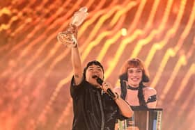Austrian singer Johannes Pietsch, known as JJ representing Austria with the song "Wasted Love" celebrates with the 2025 Eurovision Song Contest trophy after winning the grand final at the St. Jakobshalle arena in Basel on May 18, 2025.