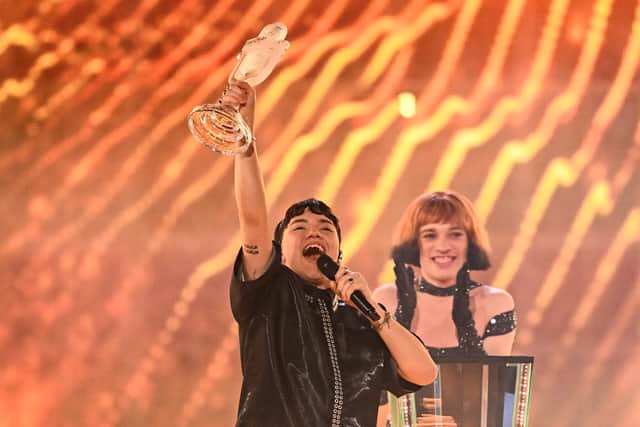 Austrian singer Johannes Pietsch, known as JJ representing Austria with the song "Wasted Love" celebrates with the 2025 Eurovision Song Contest trophy after winning the grand final at the St. Jakobshalle arena in Basel on May 18, 2025.
