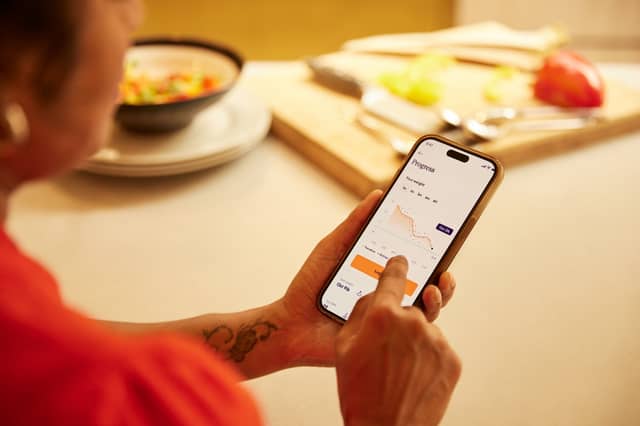 Tracking weight loss progress using the Voy app, part of a behaviour-led programme supporting Wegovy and Mounjaro users.