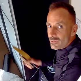 This was the moment arsonist, Martin Foley, spat in the face of a police officer as he was being rescued from a burning roof. 