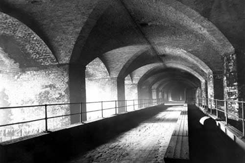 The Dark Arches on Neville Street in January 1951 . Bridge has steel girders and a concrete road running over River Aire.