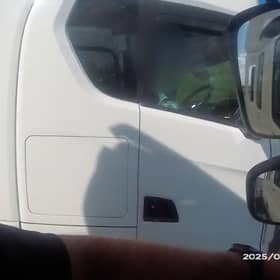 Lorry driver caught rolling cigarette with no hands on wheel