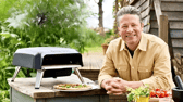 Jamie Oliver with his Tefal gas pizza oven, designed for quick, even-cooked homemade pizzas in the garden