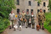 Re-enactors take time out for the doggies.