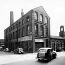 This view from  May 1950 shows buildings which once formed part of the Third White Cloth Hall, now Grade II listed. Assembly Street is on the left of the image, with Crown Street leading off to the right.