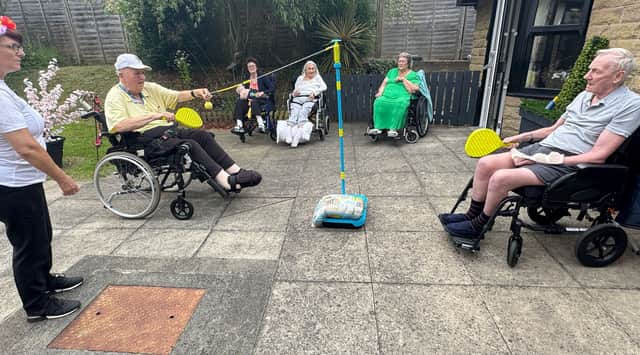 Anyone for swing ball? Residents and guests at HC-One’s Aberford Hall Care Home playing outdoor games