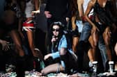 Charli XCX (c) at the Grammy Awards in 2025.
