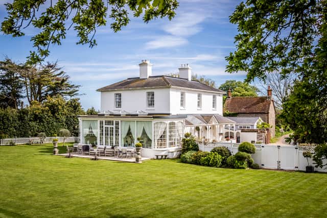 The £3 million West Sussex house sits in 1.34 acres of private, manicured gardens