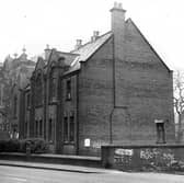 December 1972 and in focus is a side view of a large building with broken windows once the premises of the Boy's Brigade (27th Leeds Company) at the junction of Upper Wortley Road and Churchill Street.