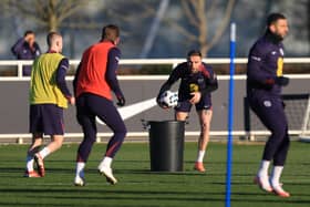 MOVE: Jordan Henderson, centre, is set to sign for Leeds United's expected key new Premier League rivals Brentford.