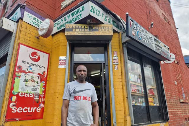 Miller Kadiri has been waiting for Leeds City Council to repair his burnt signs after they were damaged during the disorder in Harehills.