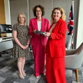 Myself and Laura Collins (Publisher, Worlds Division, National World), handing over the folder containing over 400 anonymous responses to our Endo the Battle survey to Baroness Merron, Minister for Patient Safety, Women's Health and Mental Health.