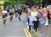 Cyclists and supporters on Wigton Lane, Leeds.