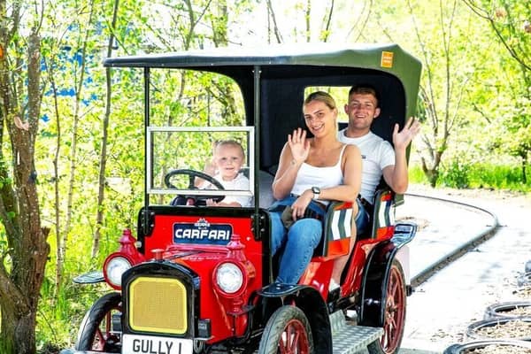A family enjoying one of the classic rides at Gulliver’s Kingdom – a perfect summer day out for kids and parents alike.