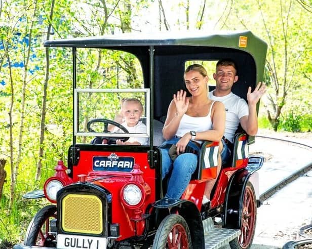 A family enjoying one of the classic rides at Gulliver’s Kingdom – a perfect summer day out for kids and parents alike.