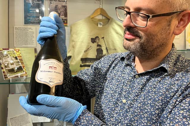 Among the items is a bottle of wine from the set of British crime drama Midsomer Murders, donated by Liza Holdsworth