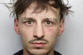 Bartlomiej Dolata, 29, is wanted over a robbery.