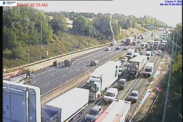 A blaze on the M62 has brought traffic to a halt - with pictures showing huge queues building on the westbound carriageway between Junction 27 (M621) and Junction 26 (M606).