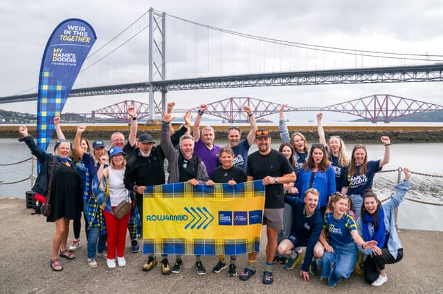 The crew of ROW4MND with friends, family and supporters at Port Edgar Marina, South Queensferry, Edinburgh, after finishing their charity row to help raise money for a cure for Motor Neurone Disease.
