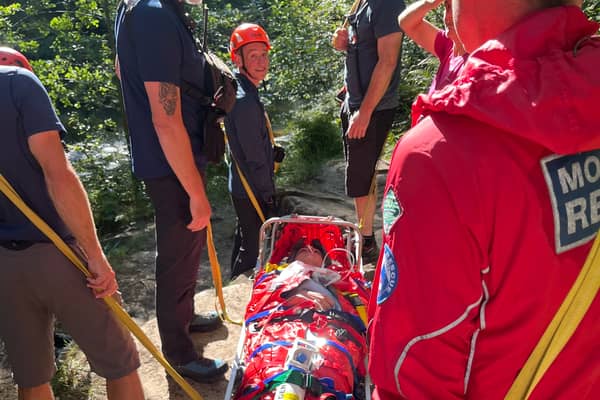 Teenager Marshall Hoyle being helped by the emergency services