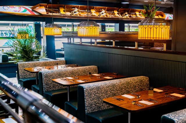 The site has a custom-designed interior that blends modern and industrial elements with traditional Persian décor.
