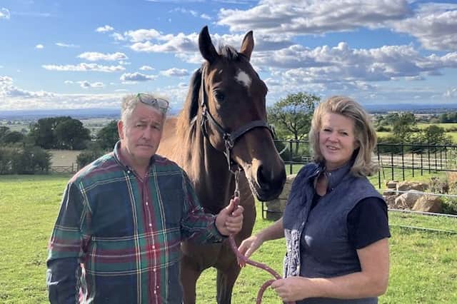 Alistair Wright and Jo Burke with another of their horses on the farm in Swainby, North Yorkshire