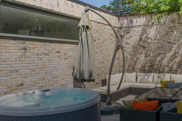 The courtyard, with its own hot tub, is part of the outside space