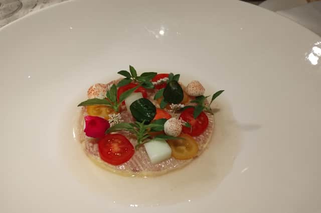 'Crudo di ricciola', an amberjack carpaccio with tomato and cucumber extract served at VICI Ristorante