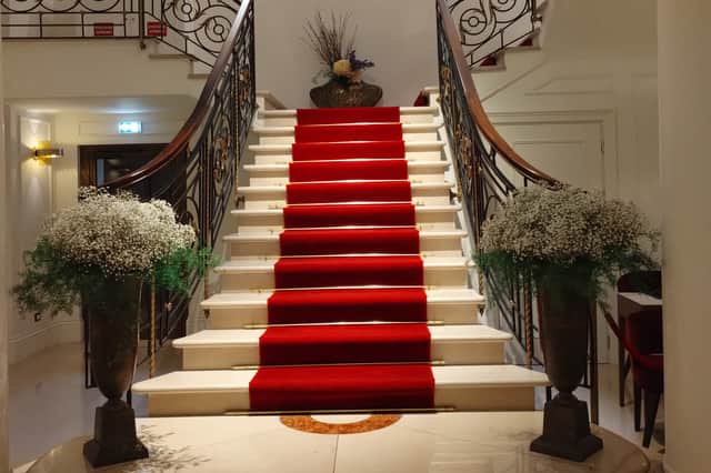 The majestic marble staircase in the hotel lobby