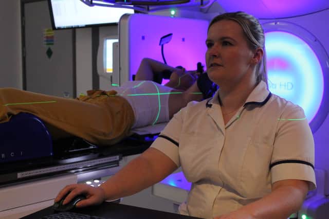Radiotherapy staff demonstrating SGRT technology