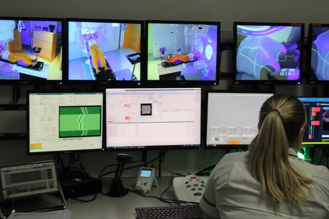 Radiotherapy staff demonstrating SGRT technology