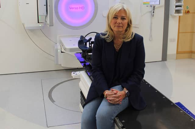 Leanne in front of the linac machine