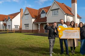 BOTB presenters Christian Williams (right) and Katie Knight (left) with the Robert Everson and his wife Carleane in front of their new dream home