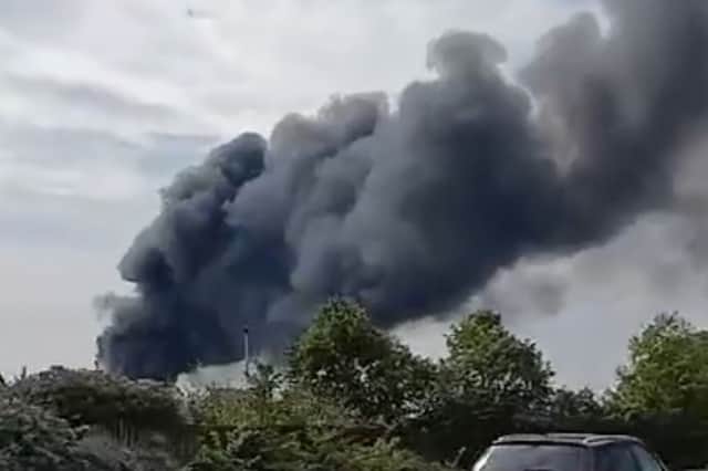Thick smoke billows from a vehicle fire on the on the Euroways Trading Estate in Bradford.