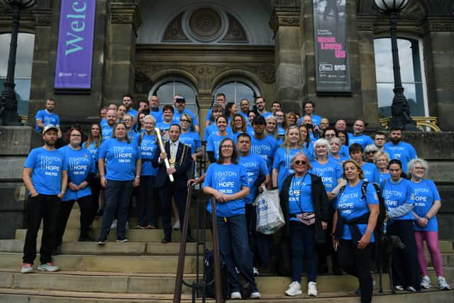 Baton of Hope barers with the Lord Mayor of Leeds on the steps of Leeds Museum.