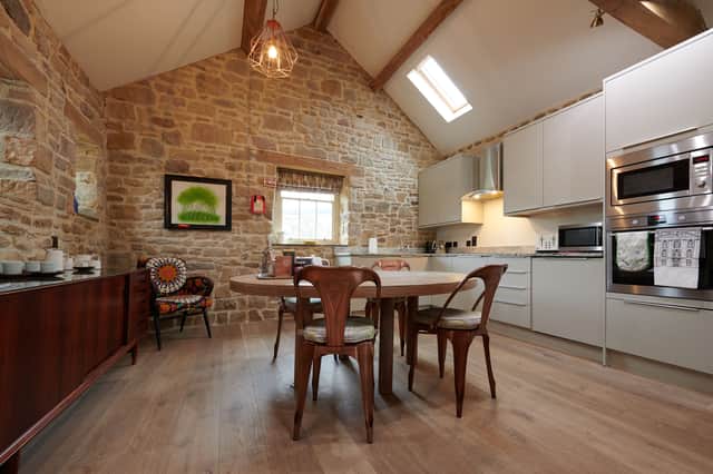 The cottage's fully-equipped kitchen has all the mod-cons