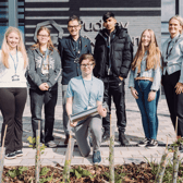 Students are burying a time capsule to mark the opening of Pudsey Sixth Form College.