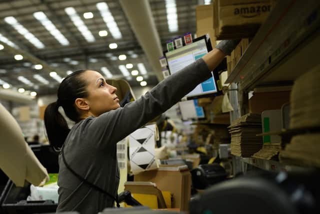 A member of staff packs items for delivery in an Amazon Fulfilment centre in Peterborough. Amazon has announced an above-inflation pay rise for tens of thousands of UK staff. (Photo: Leon Neal/Getty Images)
