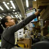 A member of staff packs items for delivery in an Amazon Fulfilment centre in Peterborough. Amazon has announced an above-inflation pay rise for tens of thousands of UK staff. (Photo: Leon Neal/Getty Images)