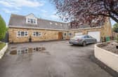 The property has plenty of land, including a large driveway