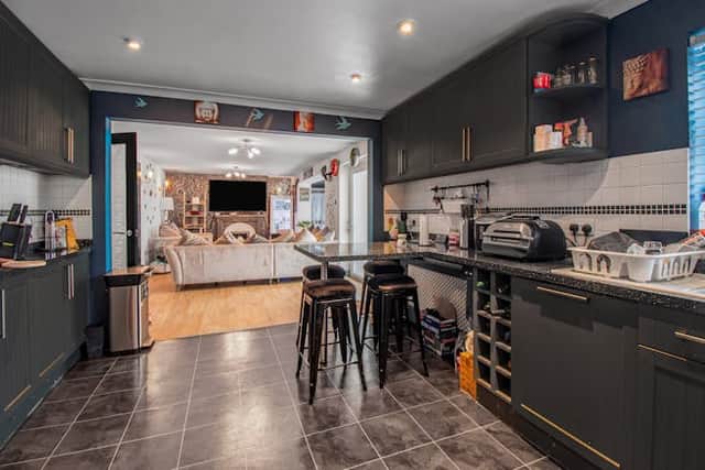 The kitchen has been designed around a modern style