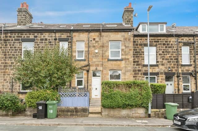 The property has a low-maintenance courtyard garden at the front