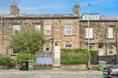 The property has a low-maintenance courtyard garden at the front