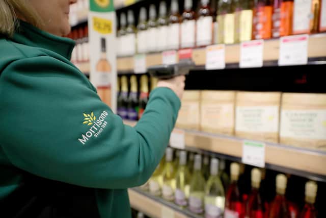A member of staff scans groceries inside Rochdale's Morrisons supermarket. The supermarket is launching a new loyalty points promotion from October 8 (Photo: Christopher Furlong/Getty Images)