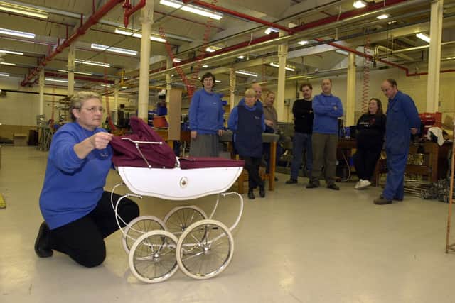 Christine Robinson from quality control with the last Silver Cross pram to be made at the factory in Guiseley in November 2002.