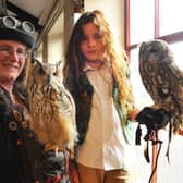 Amy Lawrence of The Flying Squadron with her Bengal Eagle Owl and Flynn Holmes, 8, with a tawny owl.