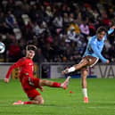 BLITZ: Leeds United youngster Charlie Crew and his Wales under-21s side were hammered 7-0 by Belgium's under-21s at Rodney Parade, above.